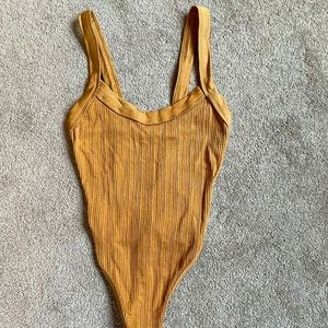 Out From Under gold bodysuit. XS/S